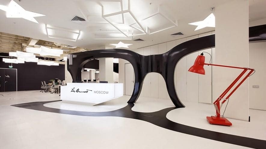 Leo Burnett front desk with a large sculpture of spectacles standing behind 
