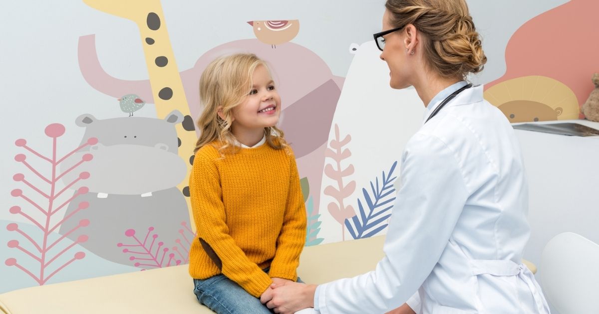 paediatrician talking to a child