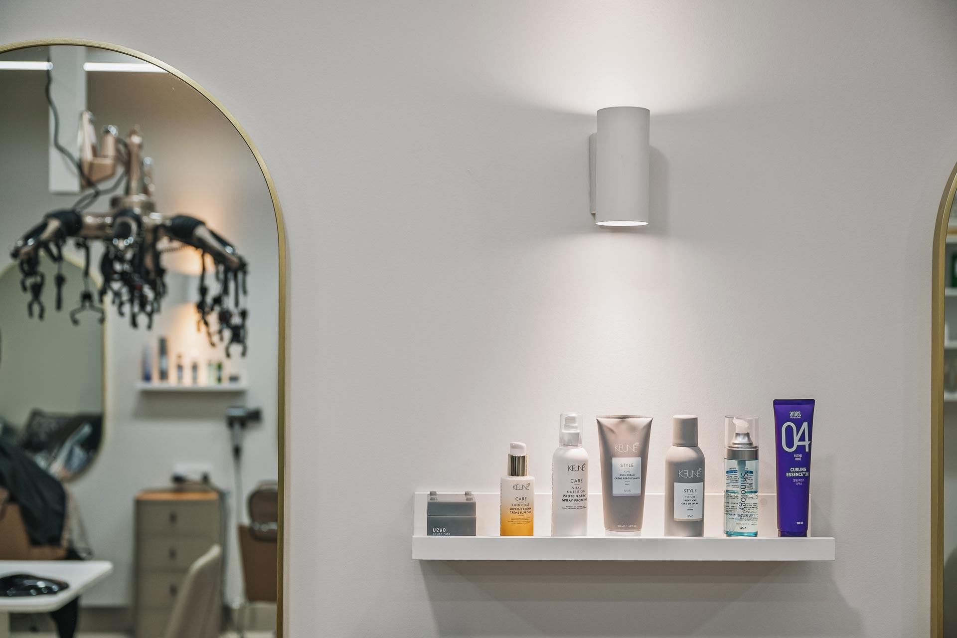 hair salon fitout with mirrors and a wall light in Perth