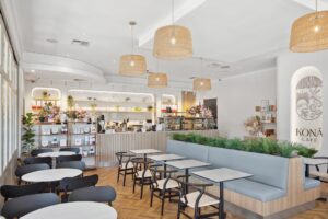 A restaurant cafe fitout in Perth, with natural timber flooring and jute lighting.