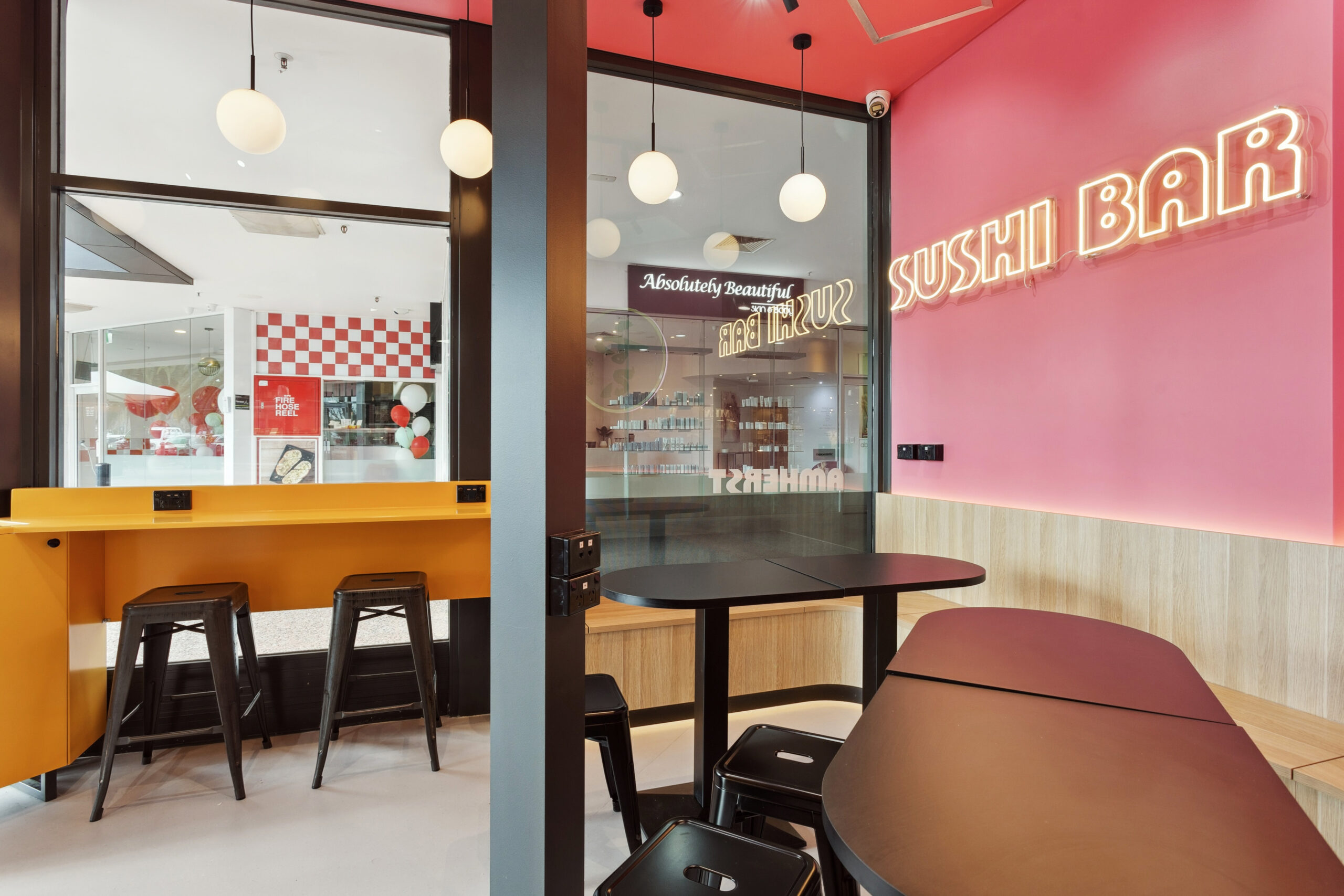 A sushi bar fitout in Noranda, Perth featuring a pink wall.