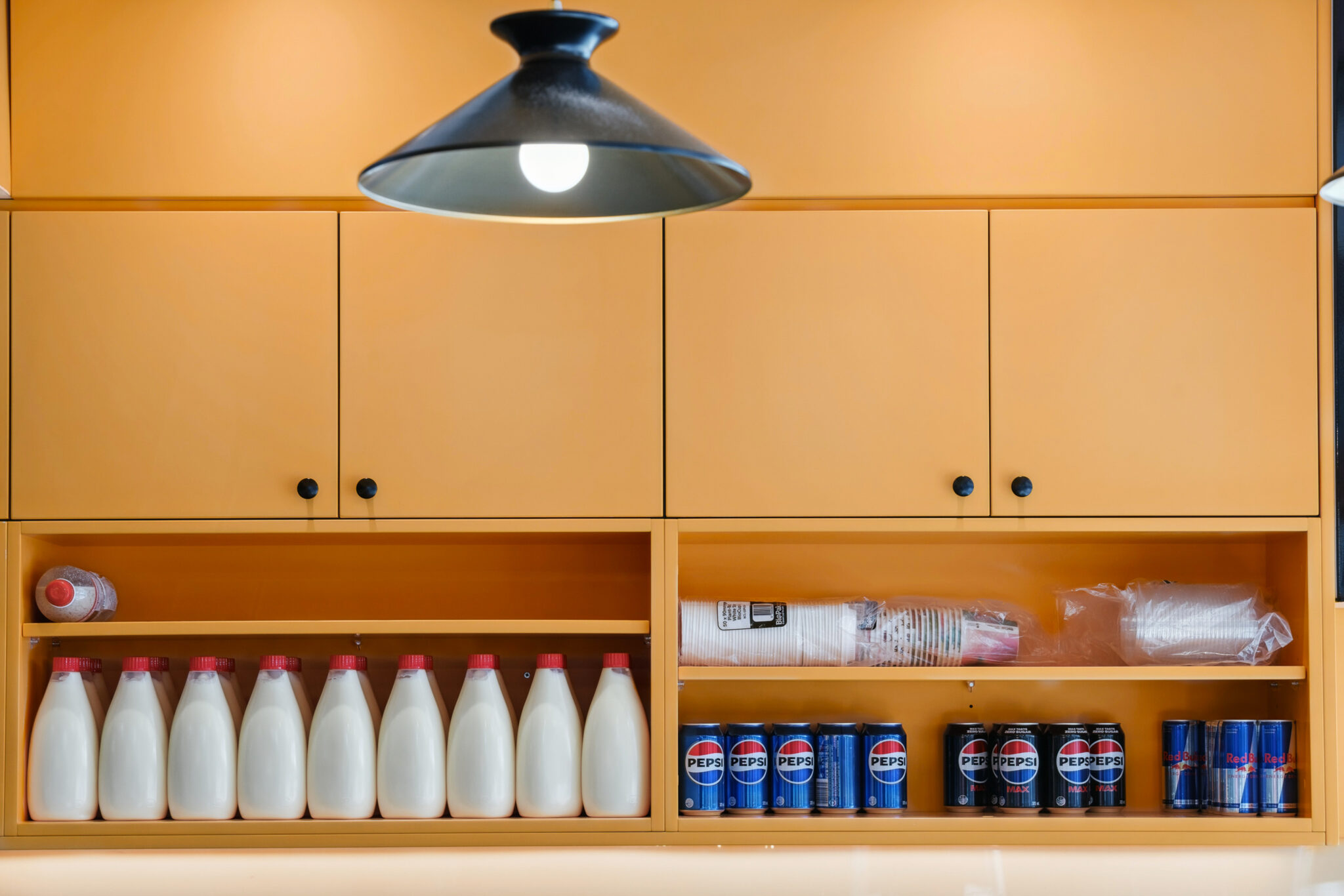 Orange cabinetry of a commercial fitout in Noranda