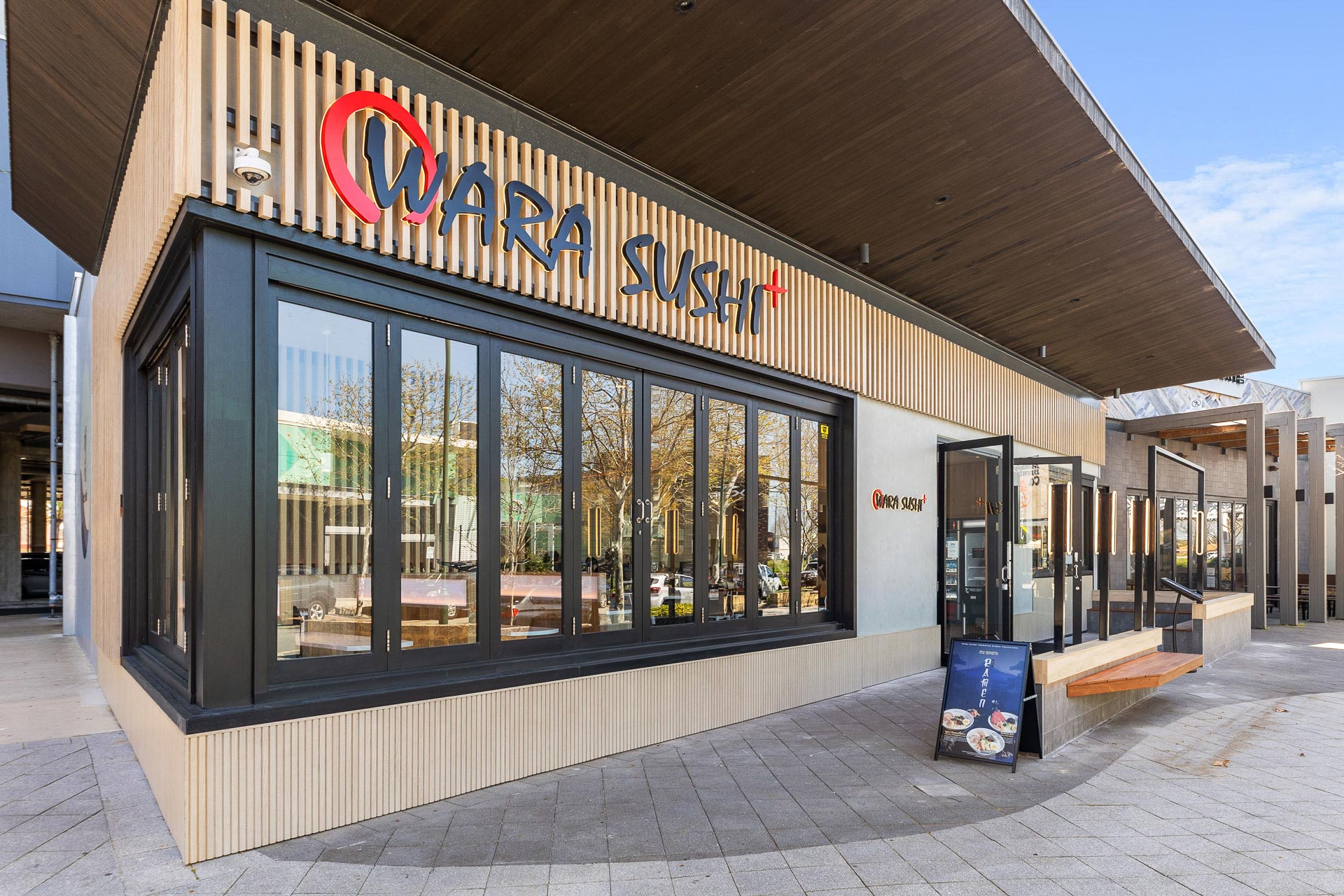 The exterior fitout of Wara Sushi in Rockingham, featuring wooden cladding.